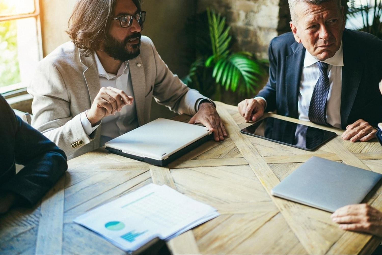Business owners discussing IT equipment purchase for a UAE office