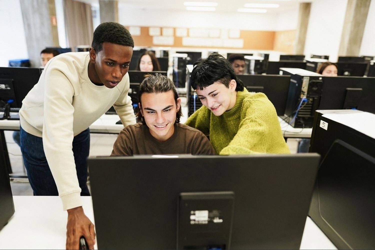 Team reviewing office workstation setup in a Dubai workspace